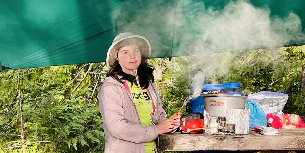cooking a nutrious meal at camp